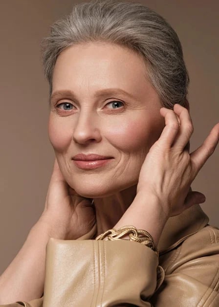 Woman in her sixties considering facelift candidacy in Palm Beach Gardens